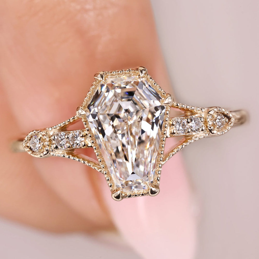 Art Deco diamond ring with coffin cut engagement design.