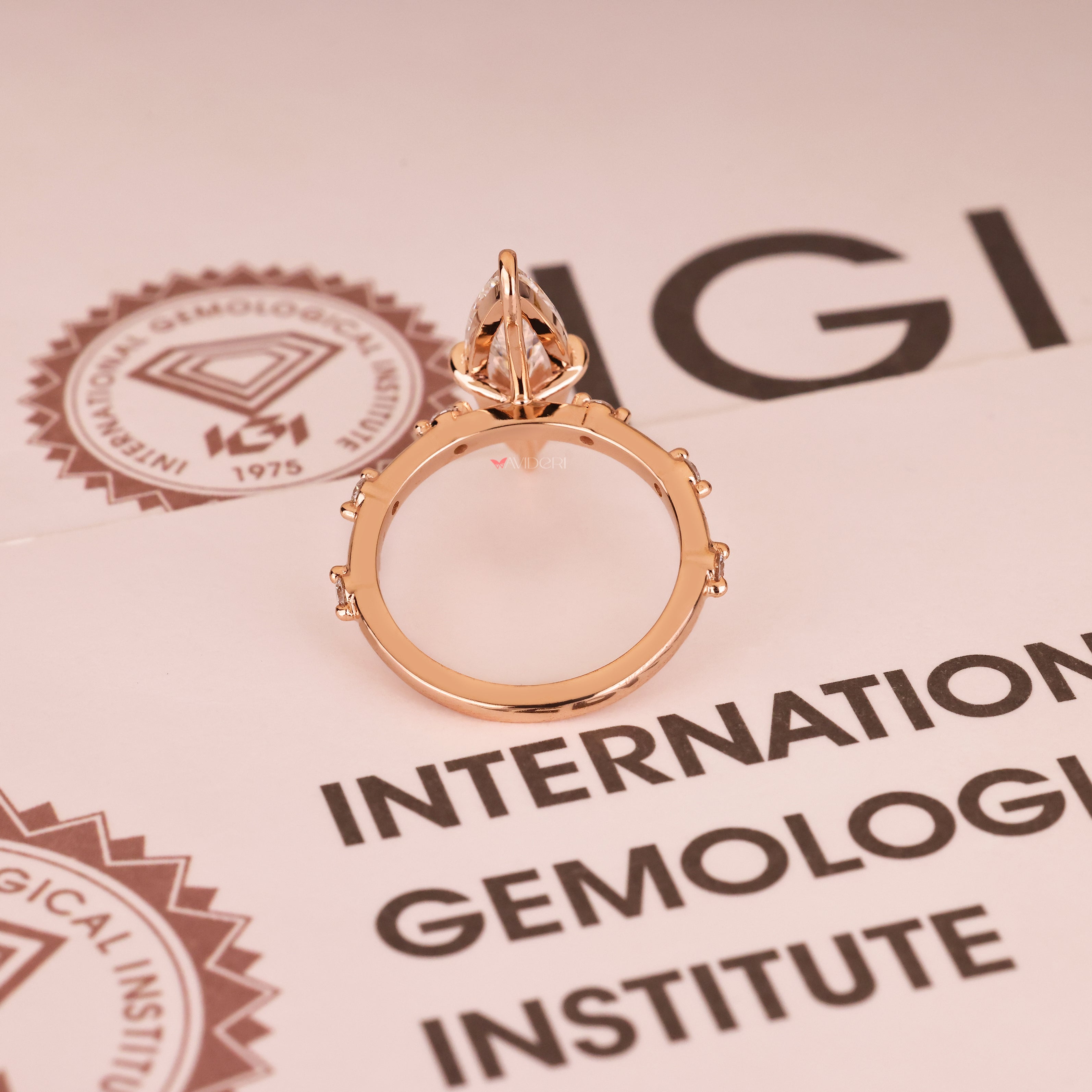 Elongated marquise diamond ring with basket and claw prongs
