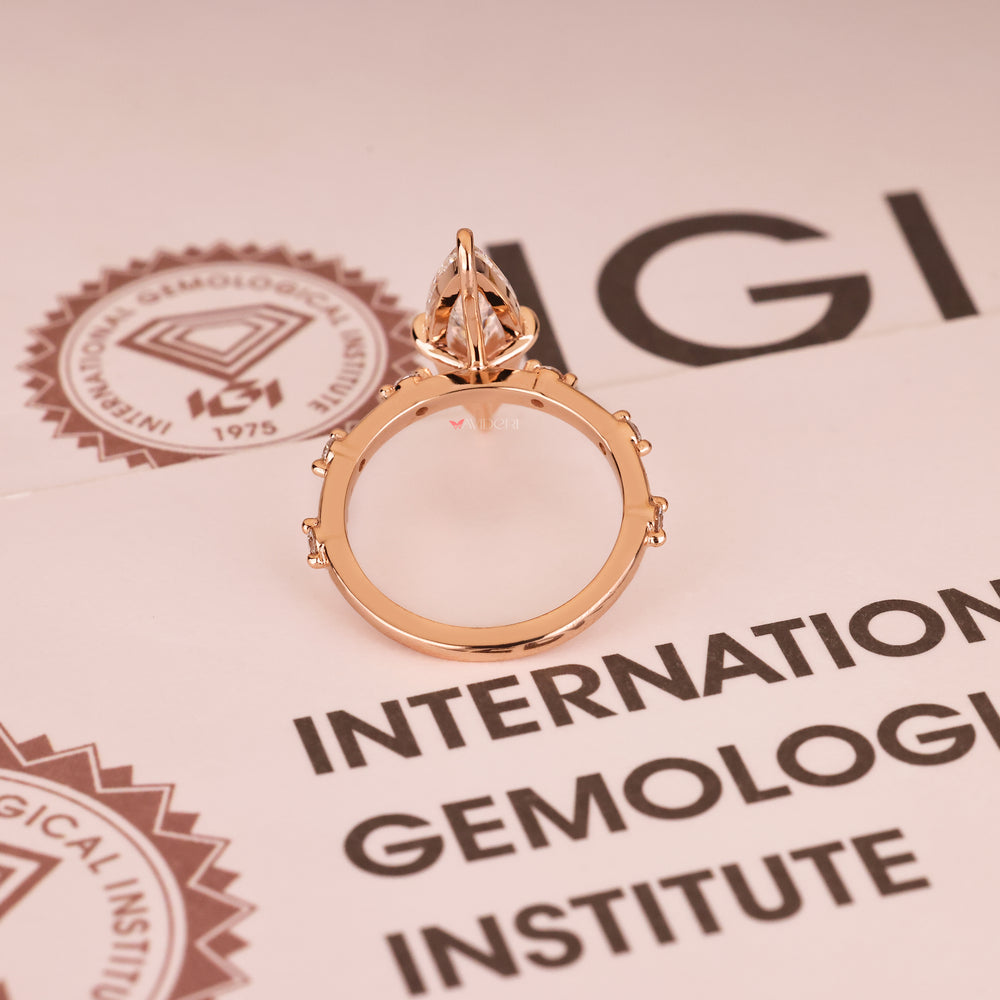 Elongated marquise diamond ring with basket and claw prongs
