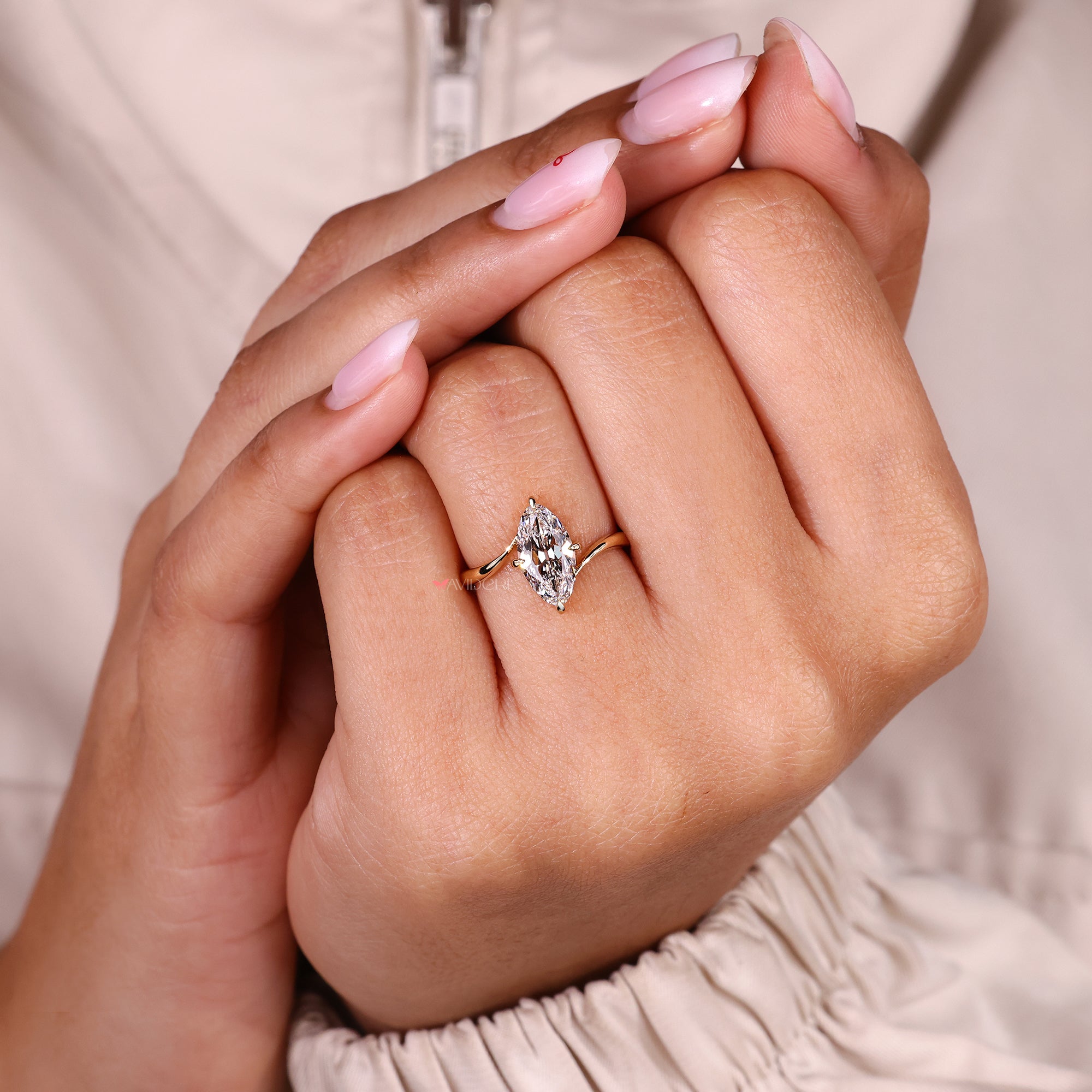 Lab grown solitaire diamond ring with bypass setting.