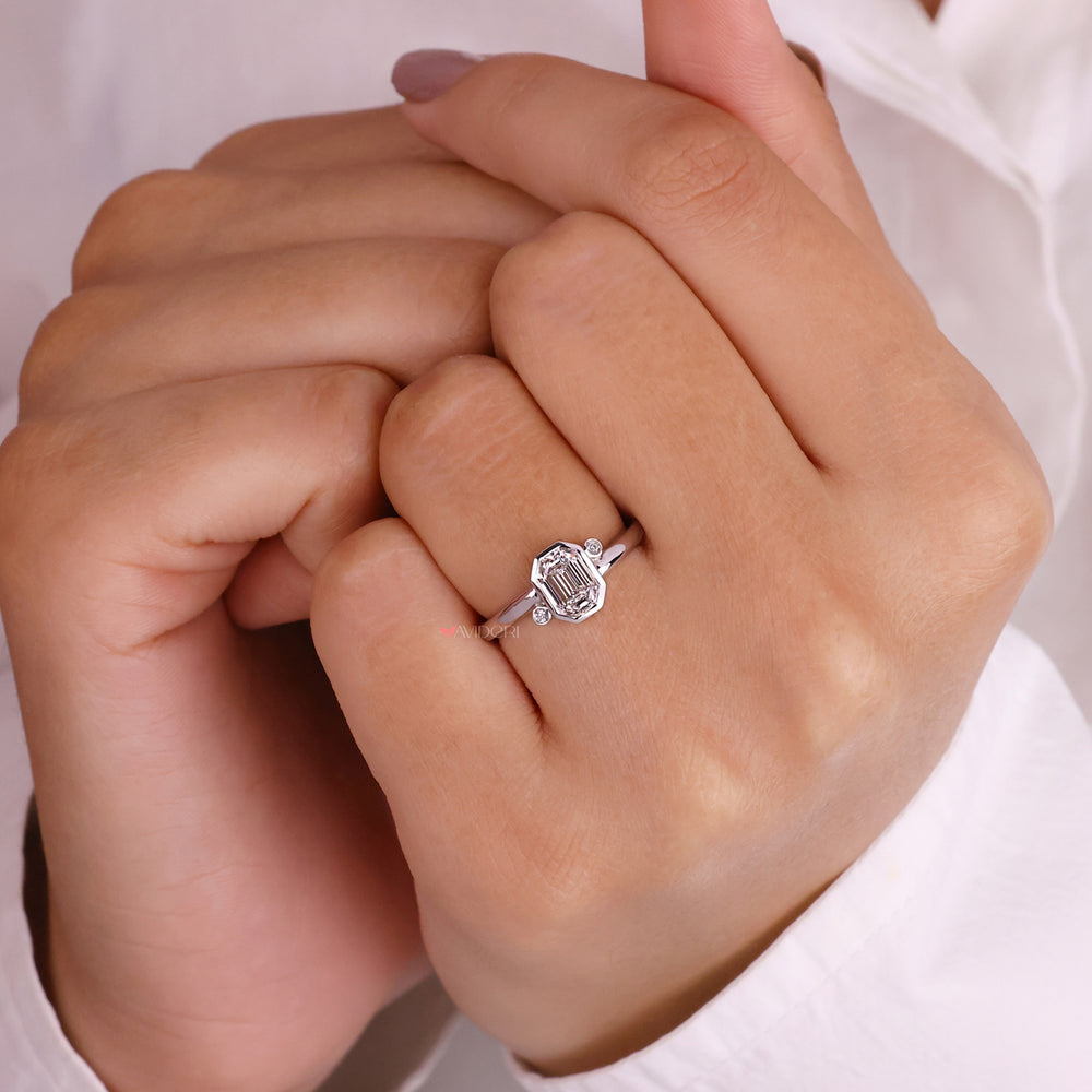 White gold engagement ring showcasing a bezel-set design.

