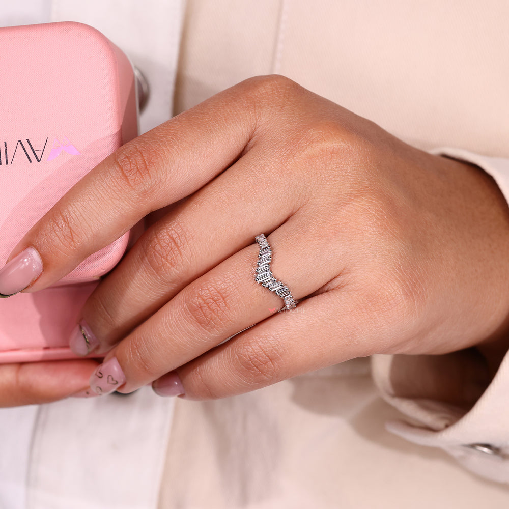 Curved half eternity band with princess cut diamonds.
