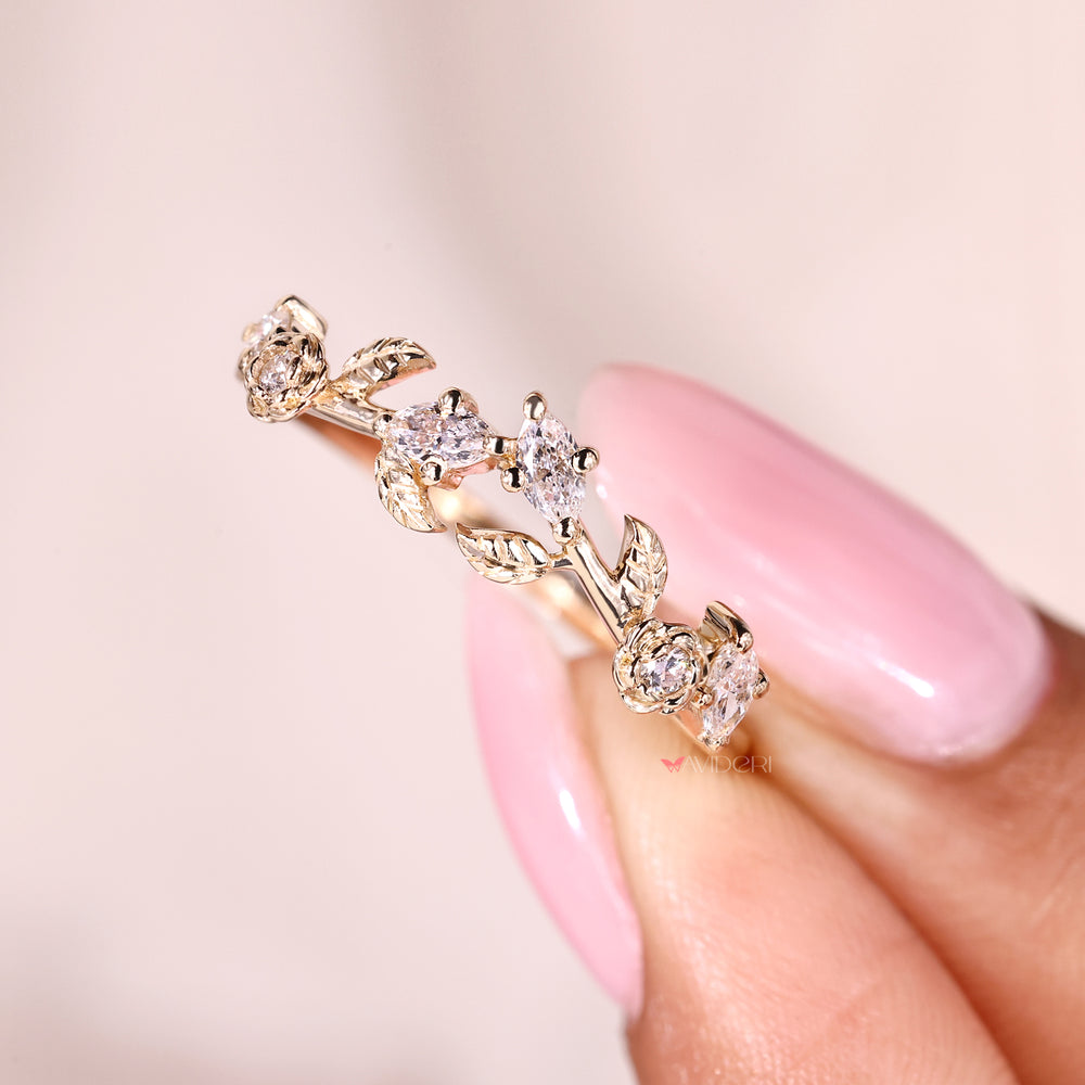 Curved nature inspired wedding band with leaf design and lab grown diamonds.