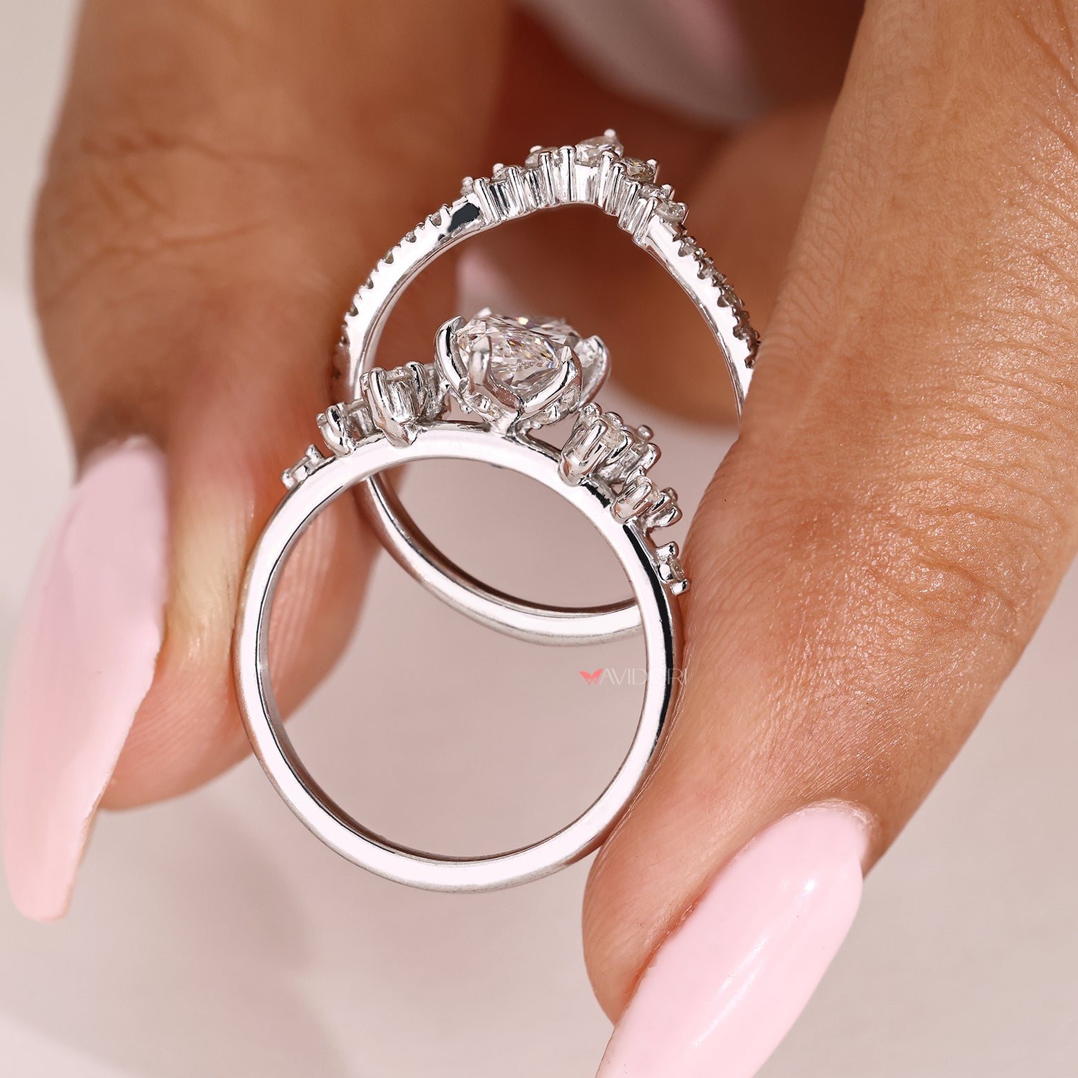 Handmade marquise ring set with round and pear diamonds
