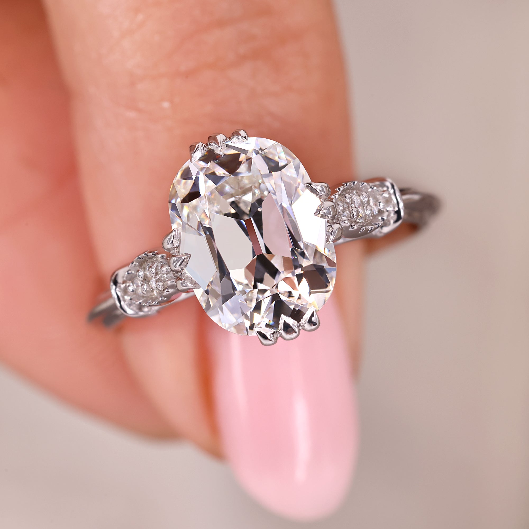 Cushion Old European Cut diamond engagement ring with cathedral setting.
