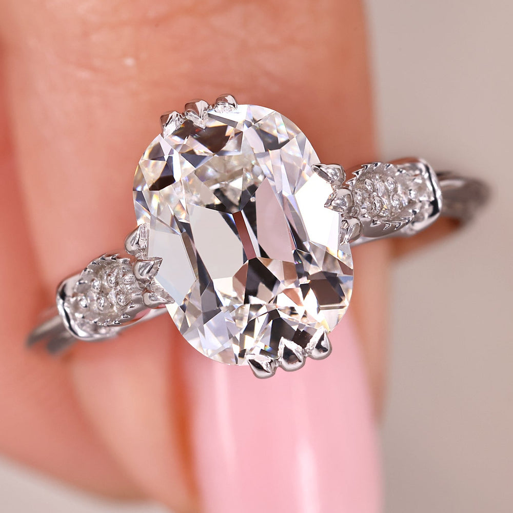 Cushion Old European Cut diamond engagement ring with cathedral setting.
