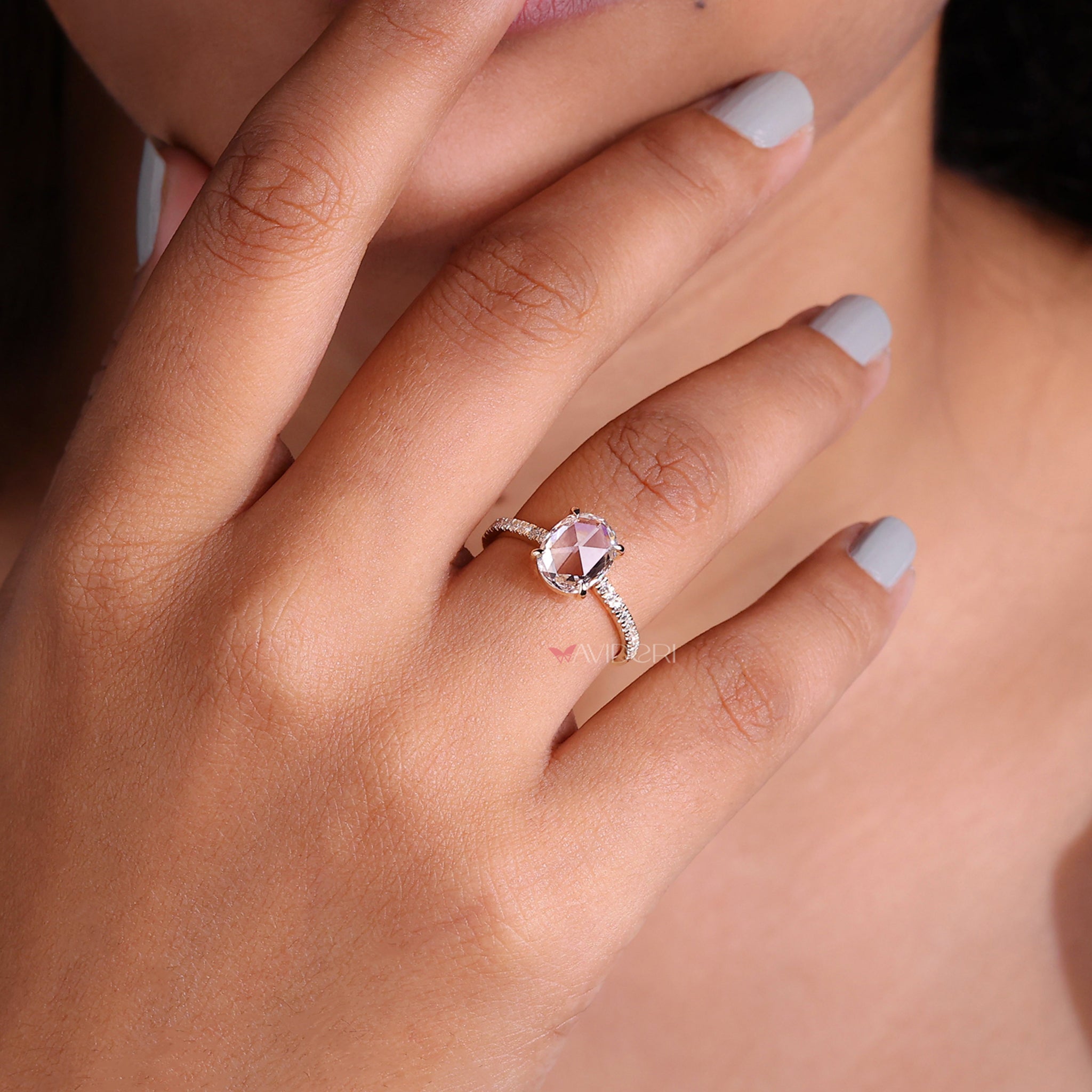 Round diamond engagement ring featuring a dazzling center stone for a perfect romantic gesture.