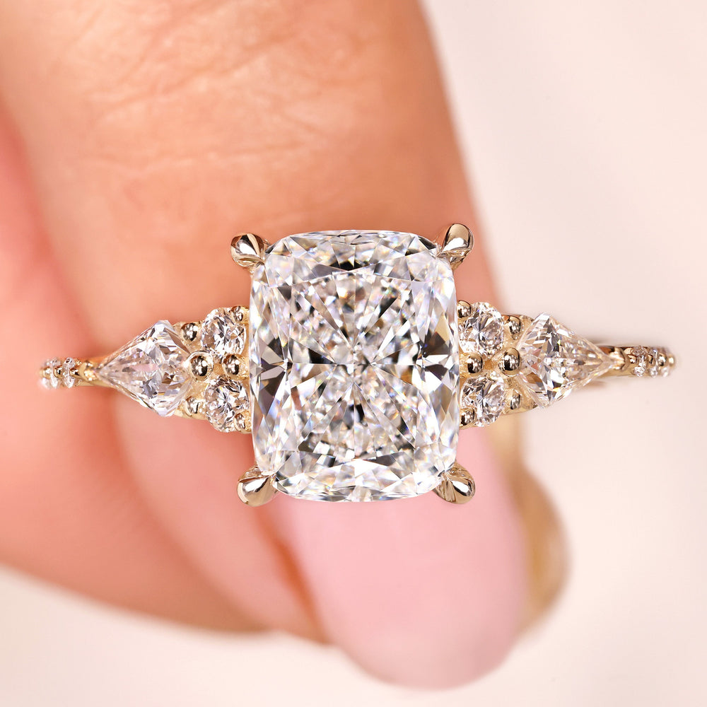 Cushion cut lab grown diamond ring with kite side stones.
