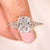 Cushion cut lab grown diamond ring with kite side stones.
