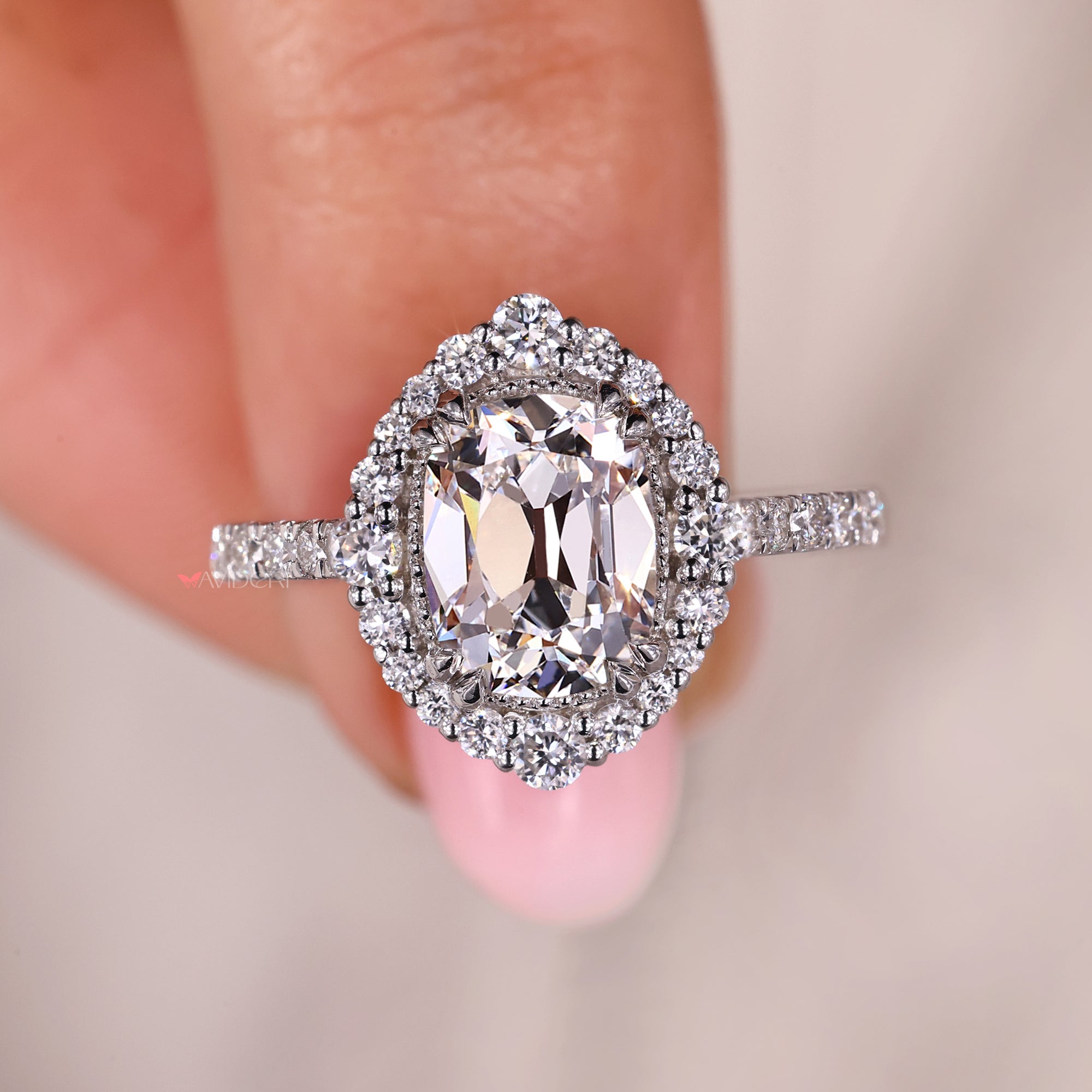 Milgrain setting engagement ring with cushion Old European Cut diamond.