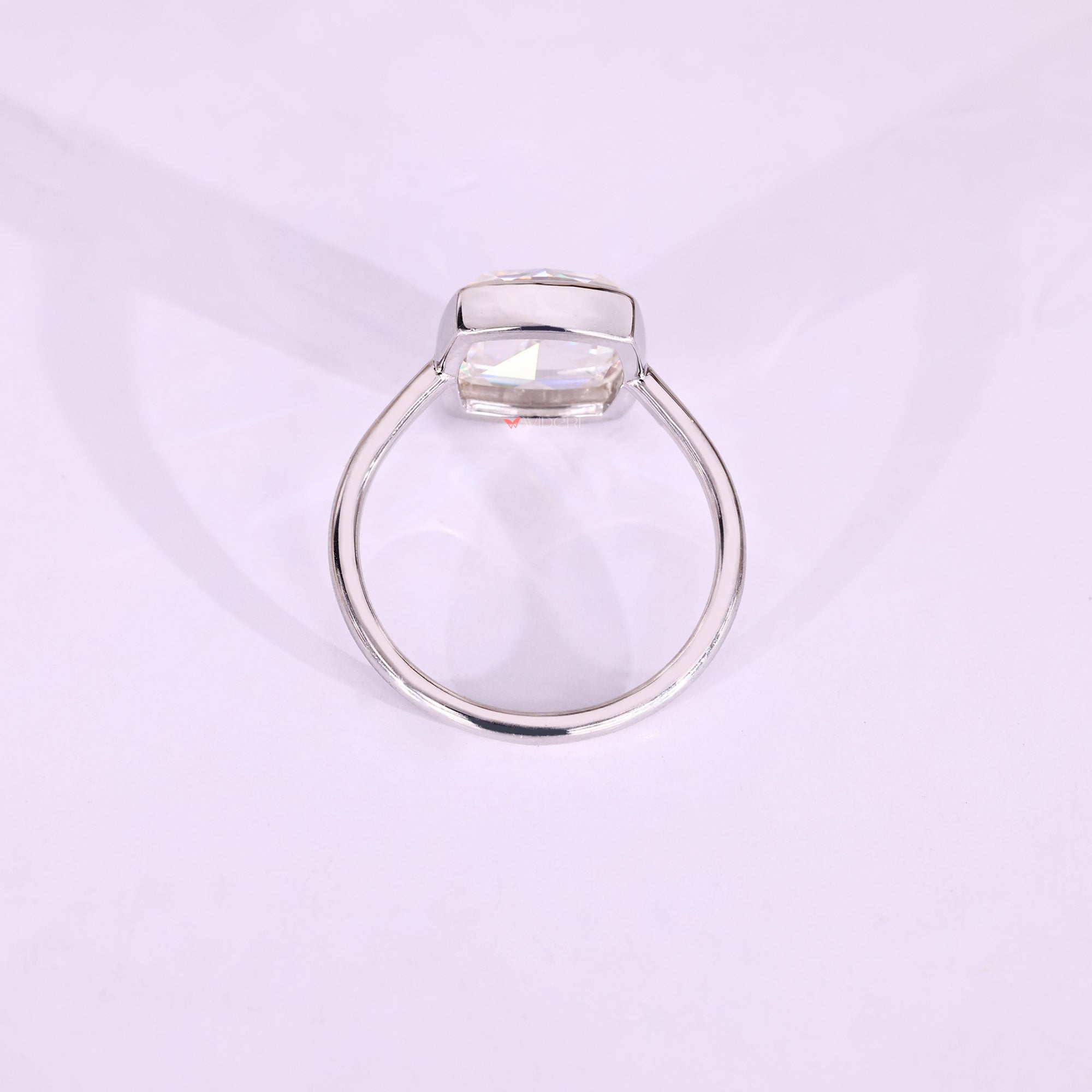 Cushion rose cut moissanite bezel set ring.
