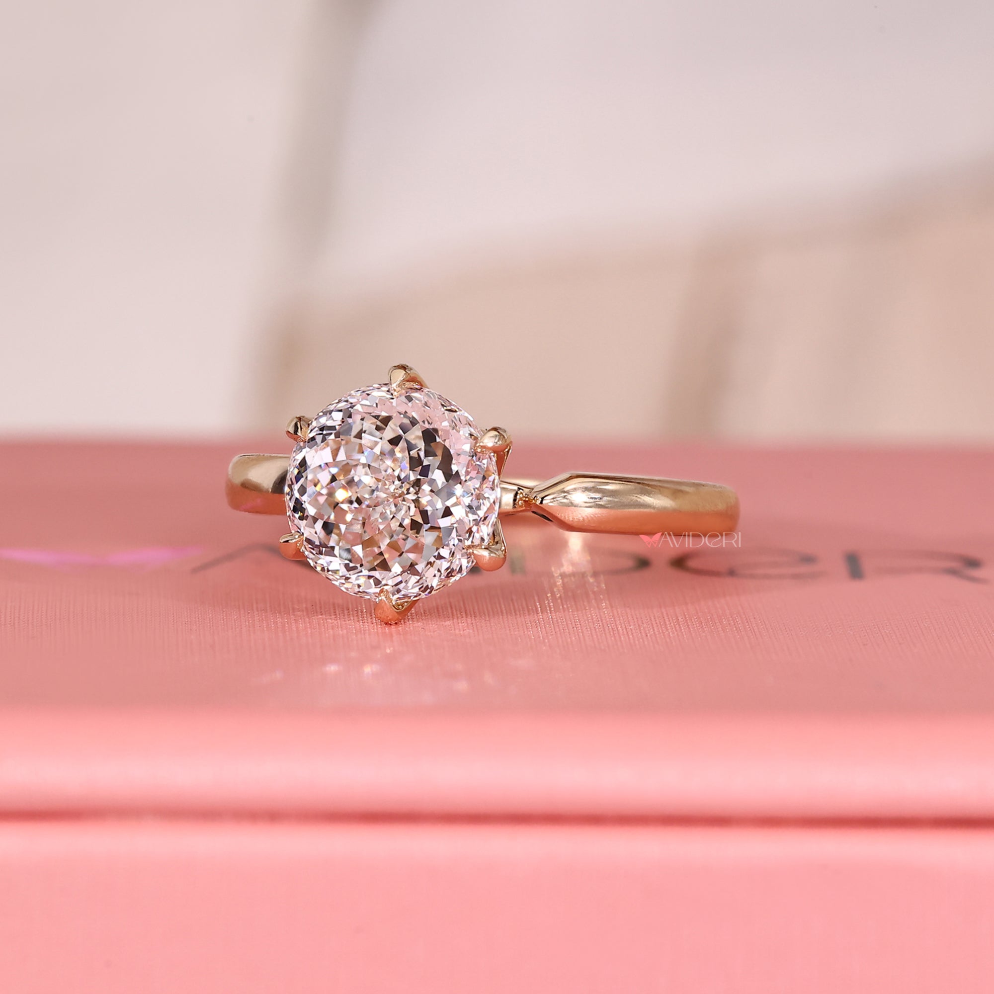 Avideri ring with Portuguese cut diamond solitaire.