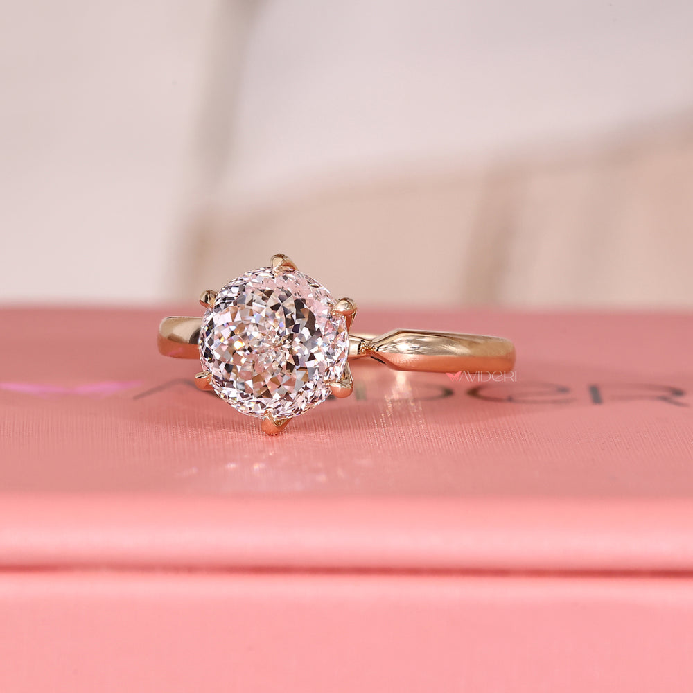 Avideri ring with Portuguese cut diamond solitaire.