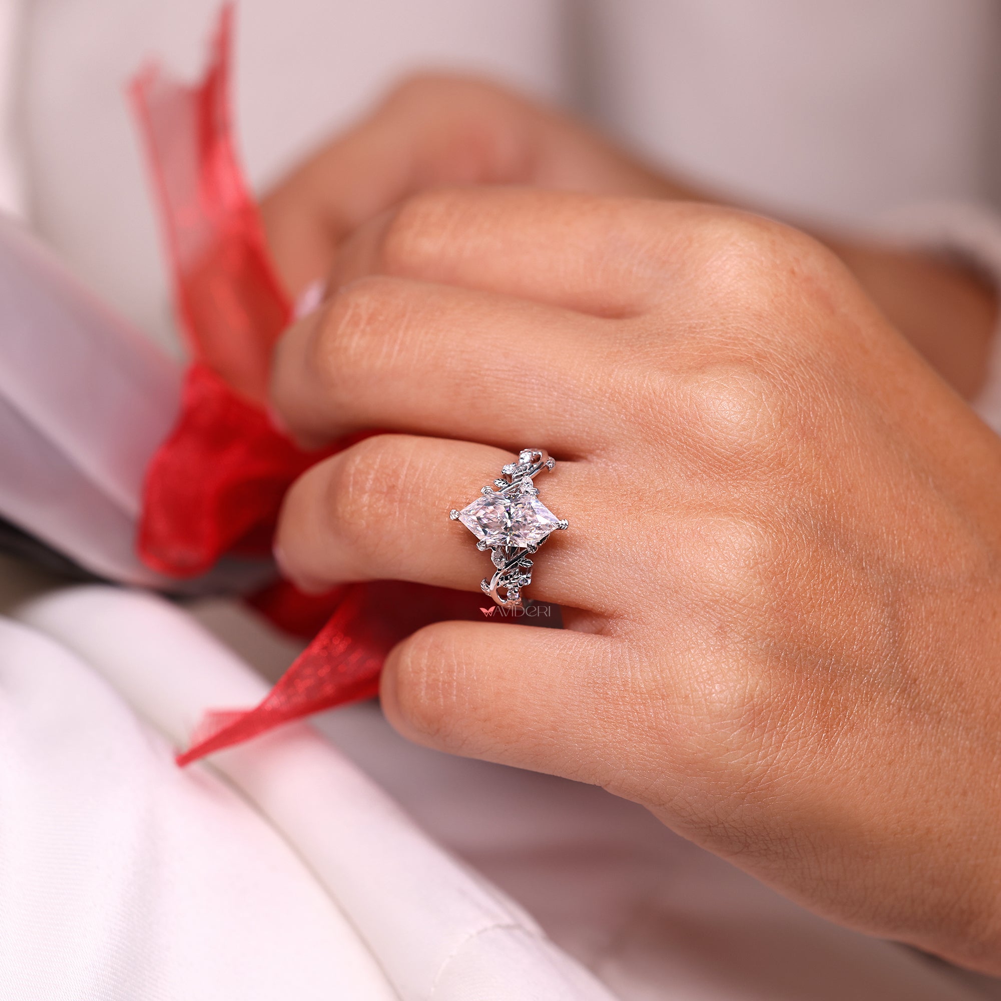 Dutch marquise engagement ring in cluster setting ring.