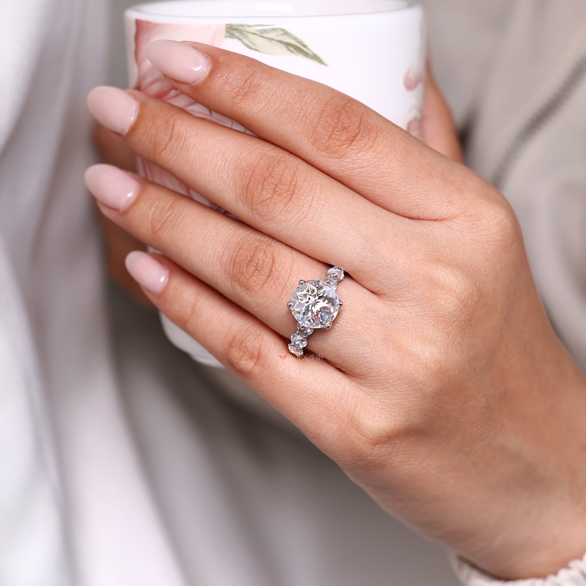 Custom engagement ring with tulip setting.