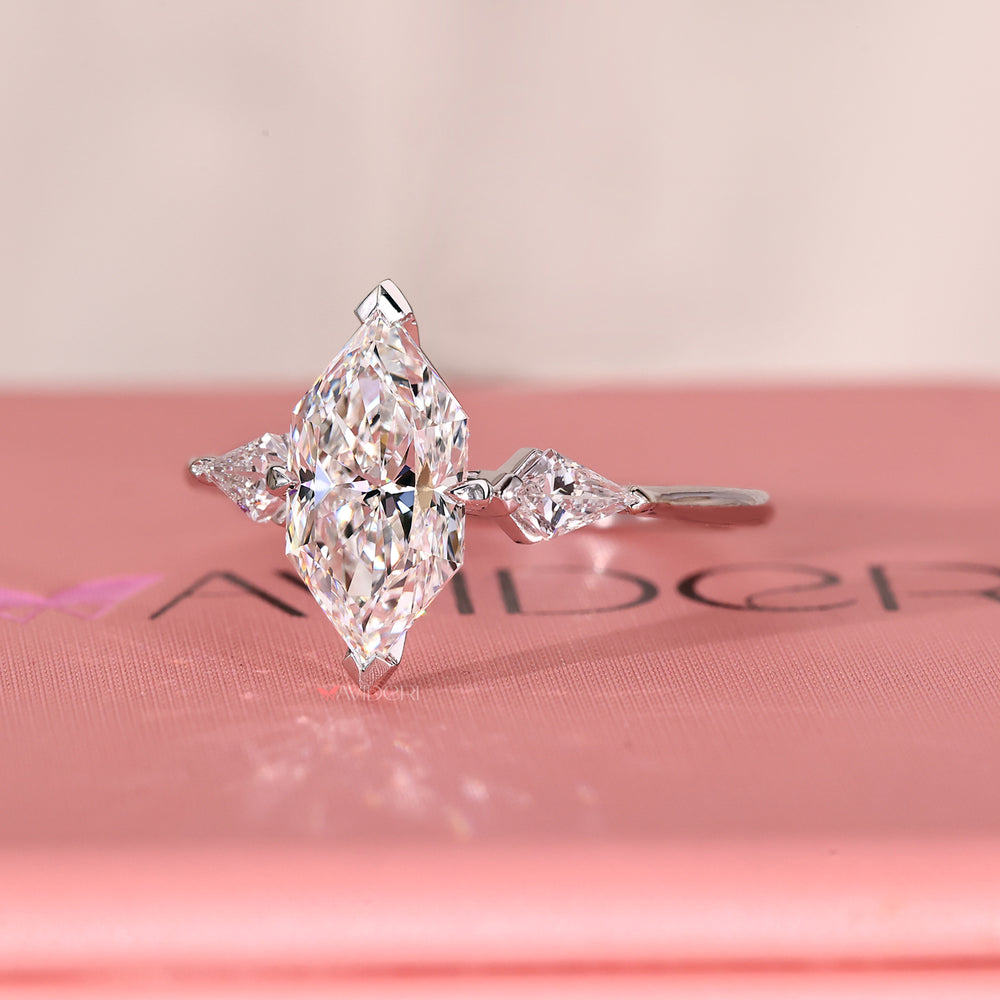 Handmade ring with Dutch marquise diamond and custom v shaped prong setting.