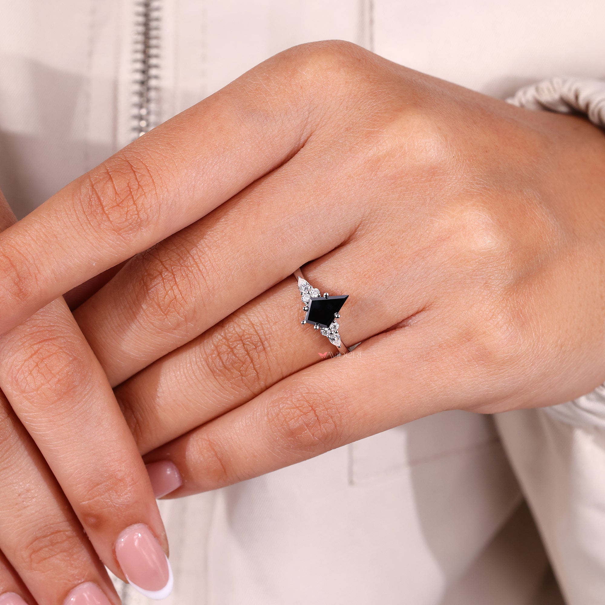 Round and pear side stone ring with custom handmade design.