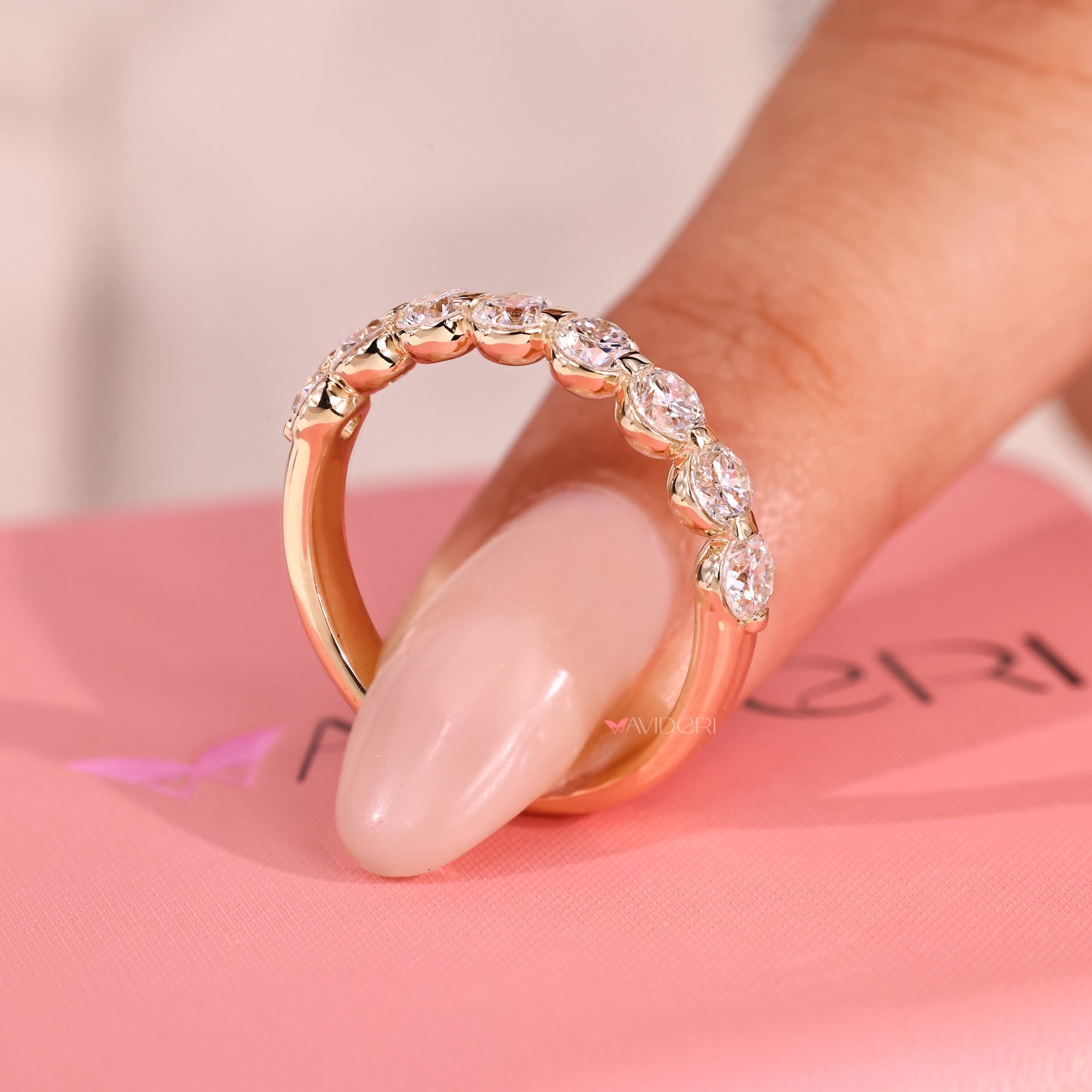 Shared prong eternity band with lab grown diamond.