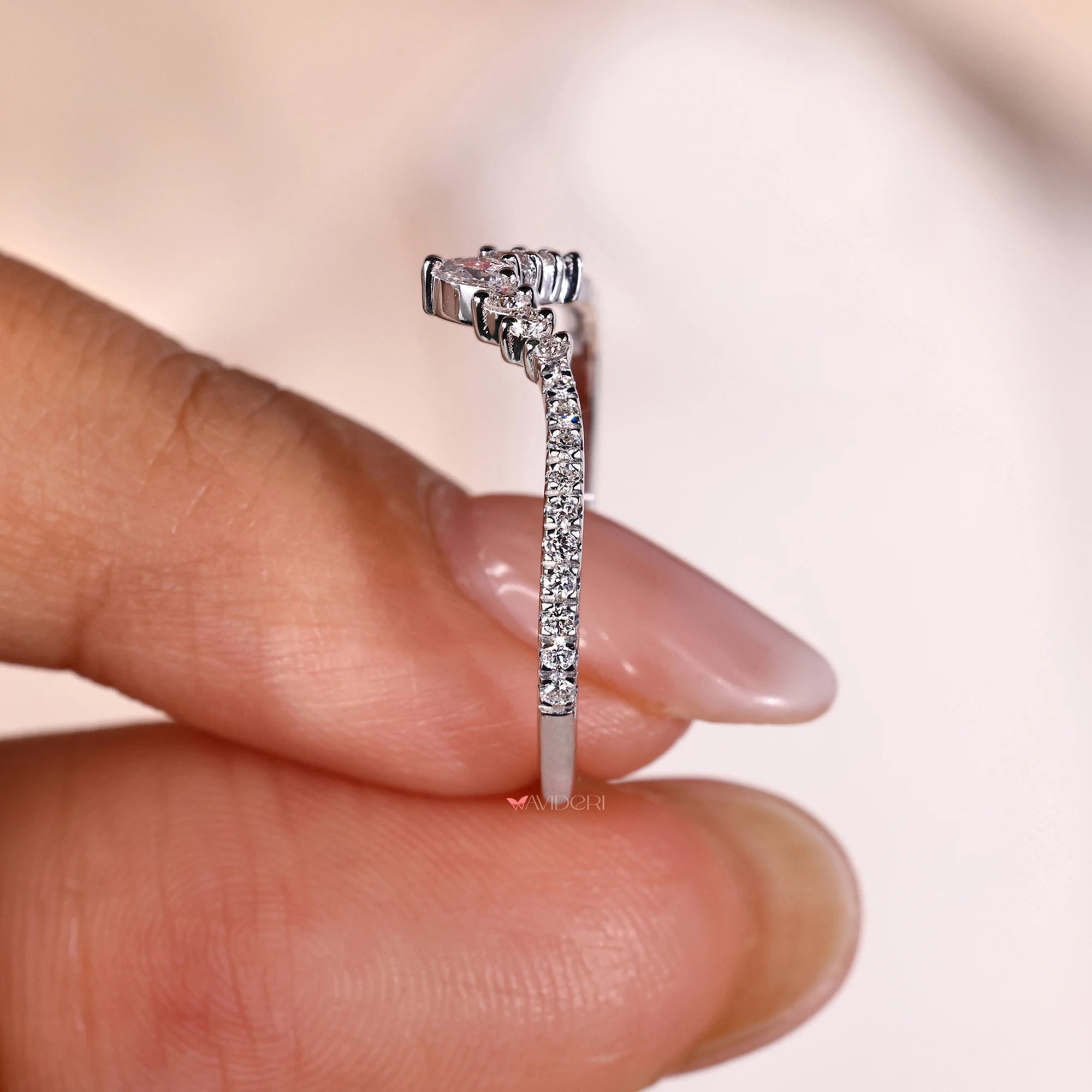 Buy a wedding band with lab grown diamond.