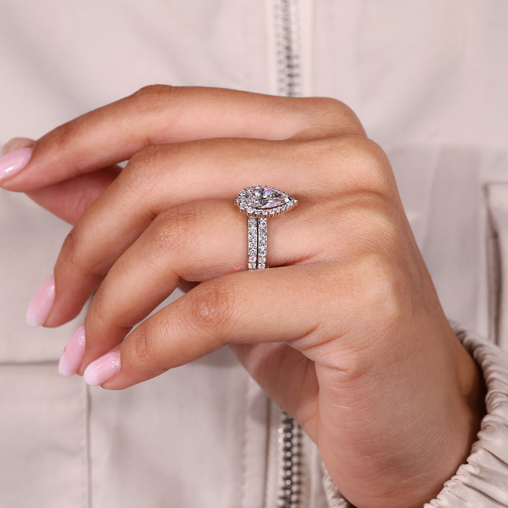 White gold bridal set with pear diamond ring.