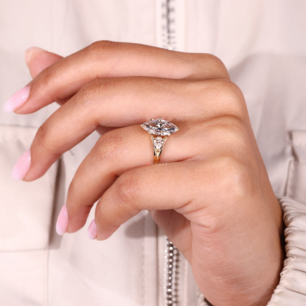 Buy engagement ring with three stone design.