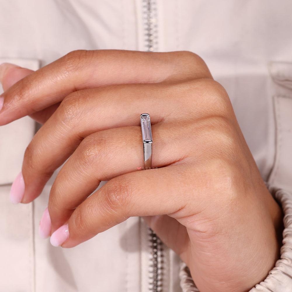 East to west diamond ring with baguette stone.