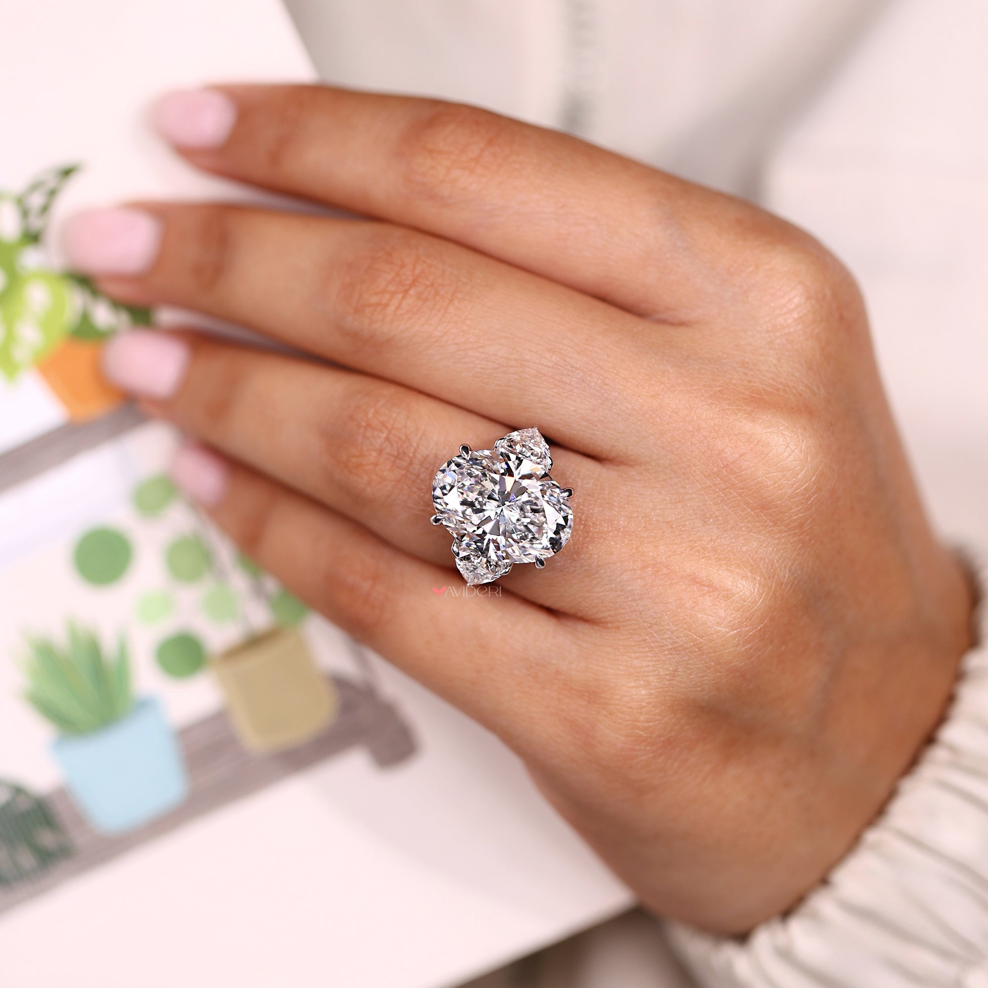 Oval Cut Diamond Three Stone Engagement Ring in White Gold.