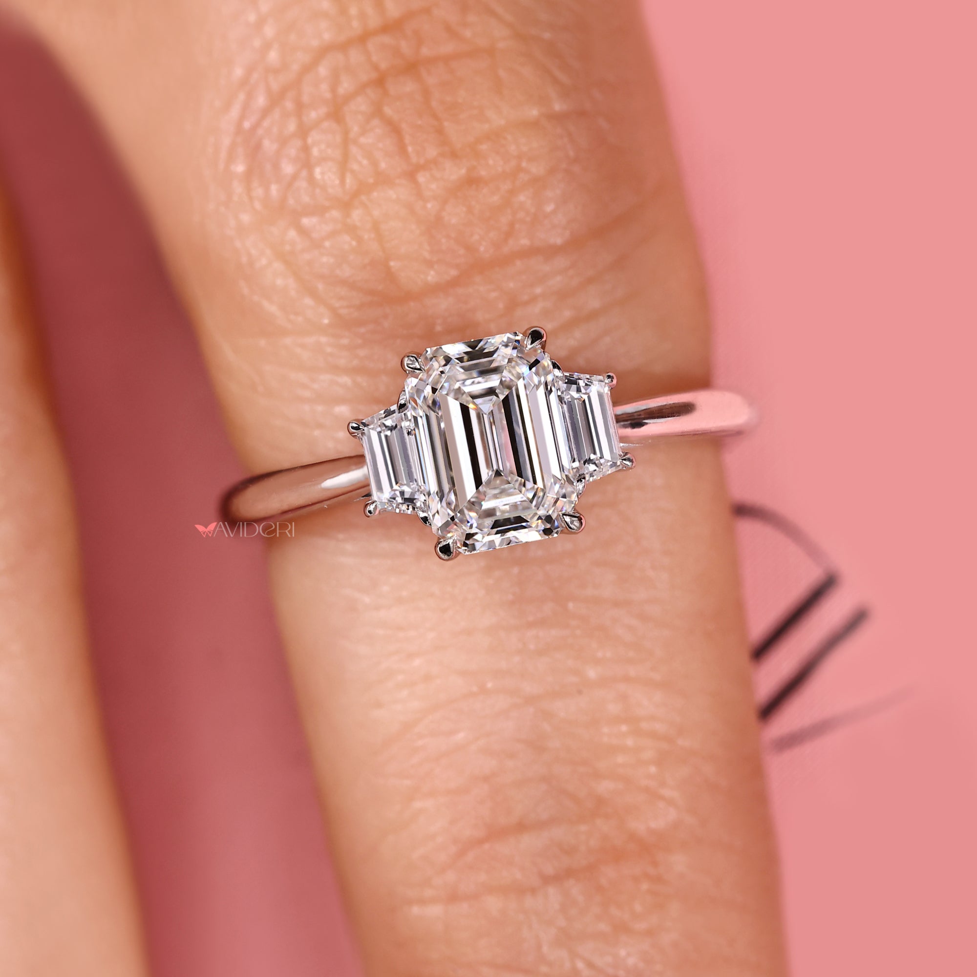 Three stone ring with tapered shank and custom white gold design.
