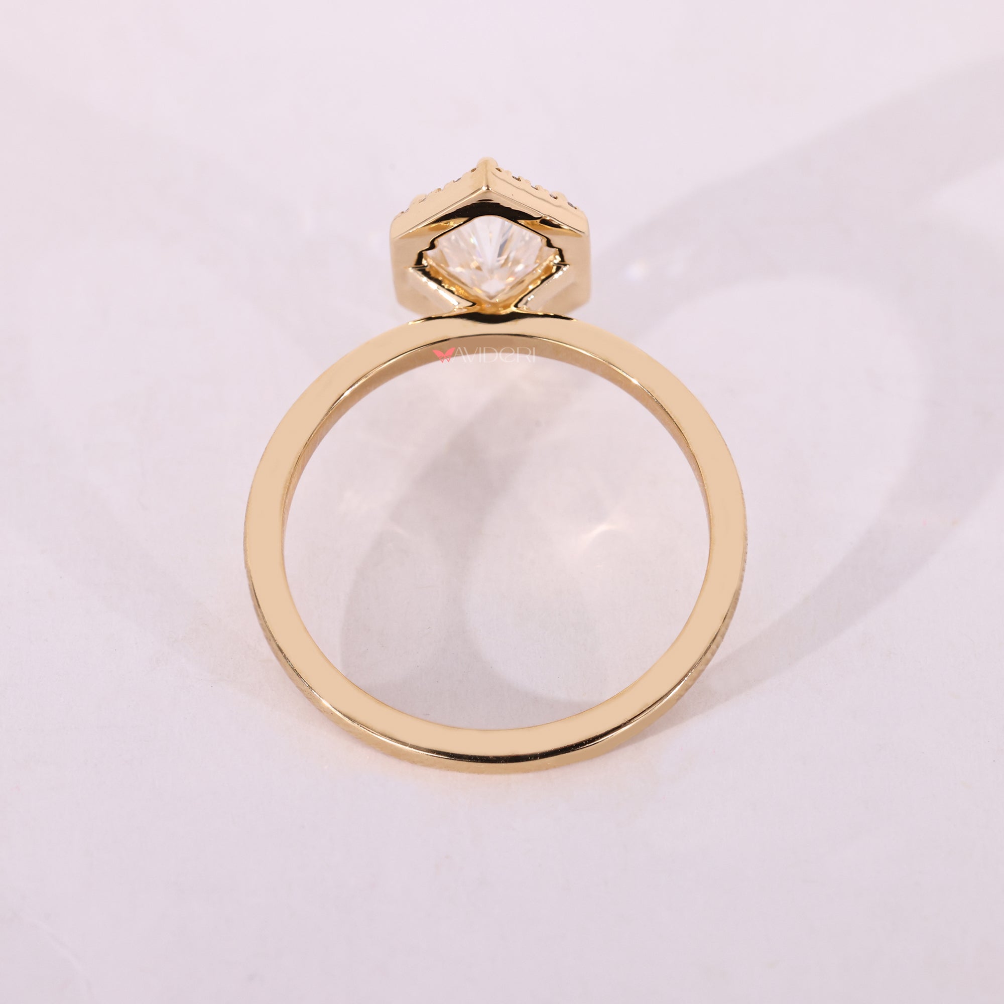 Yellow gold engagement ring with lab grown diamonds.