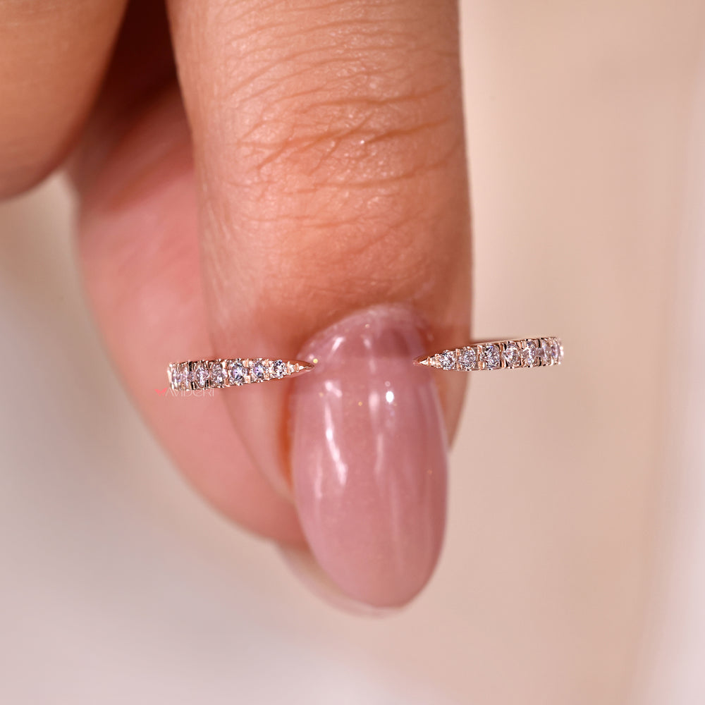 Pinched wedding band designed to pair seamlessly with a round diamond engagement ring

