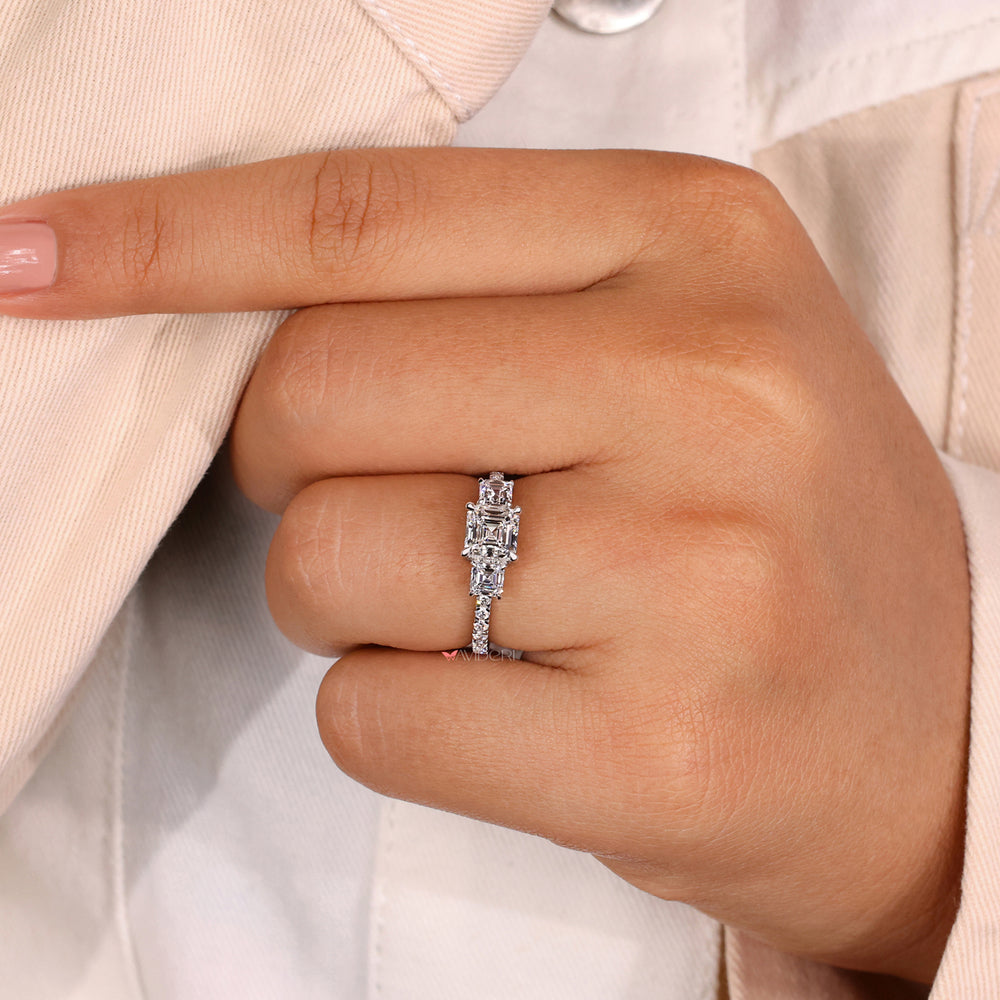 Gold engagement ring with a round diamond engagement ring.
