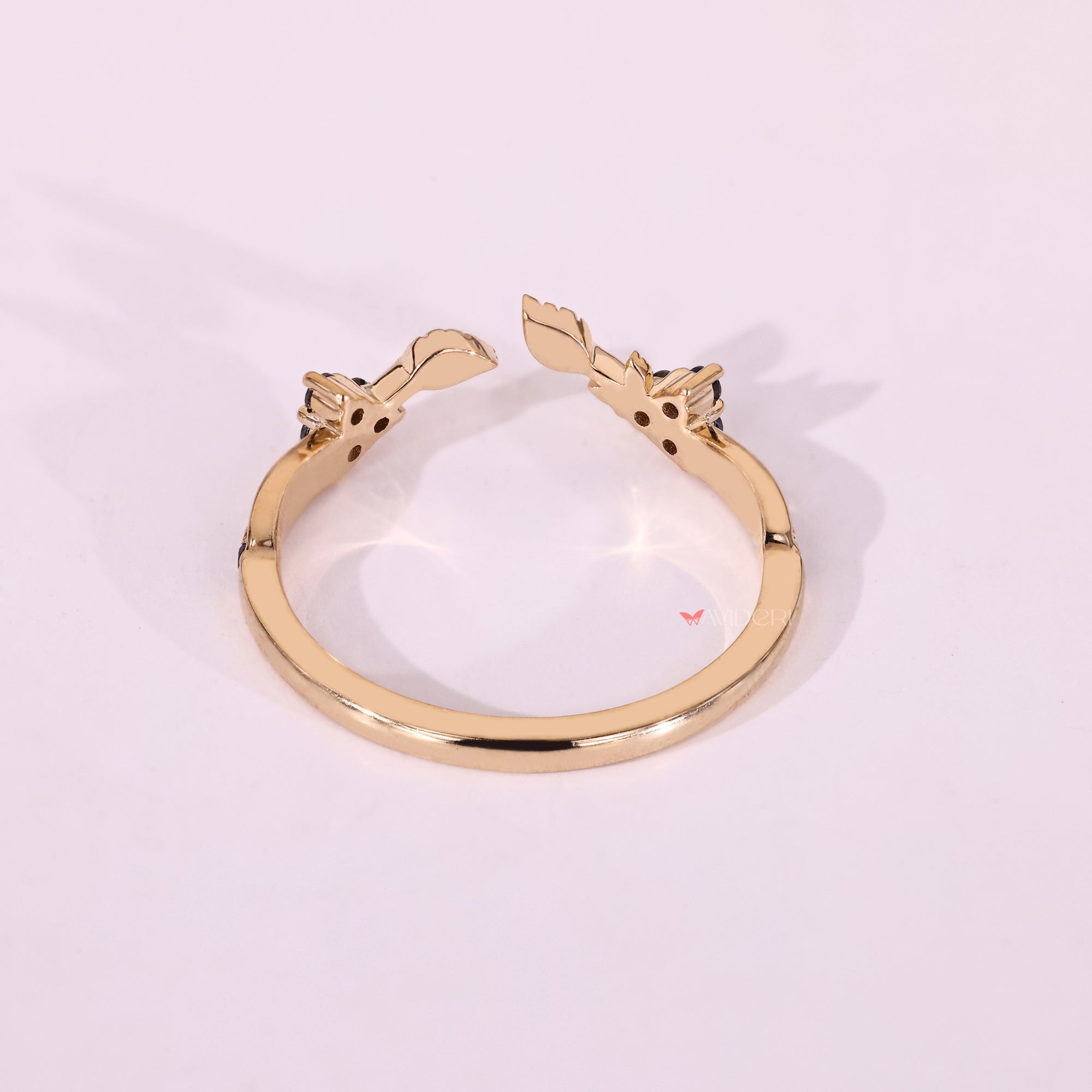 Yellow gold moissanite band with round moissanite and stackable shape.