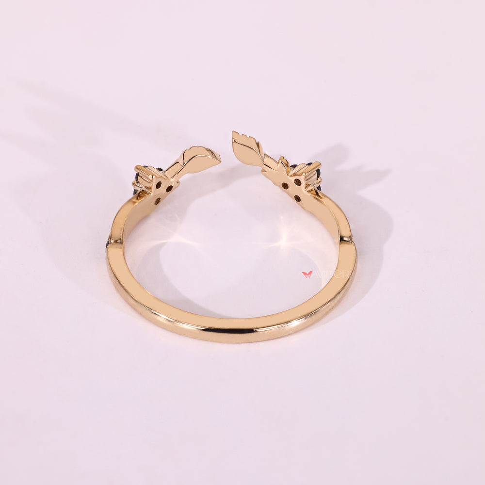 Yellow gold moissanite band with round moissanite and stackable shape.