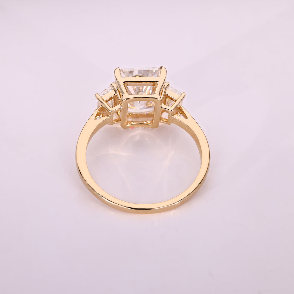 Moissanite engagement ring with radiant center stone.