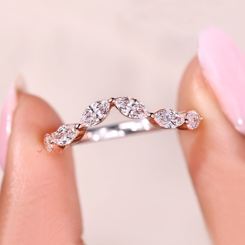 Buy a wedding band with curved diamond setting.
