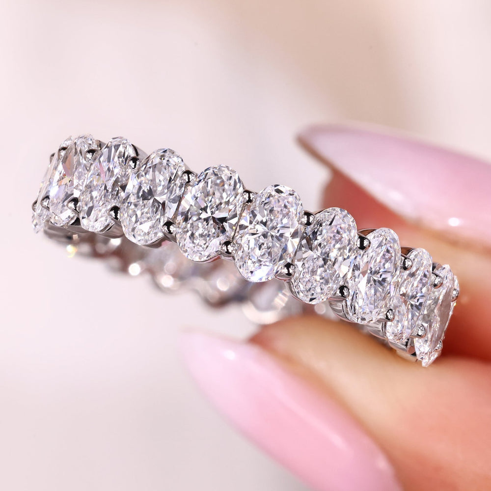 Custom wedding band with oval cut diamonds.