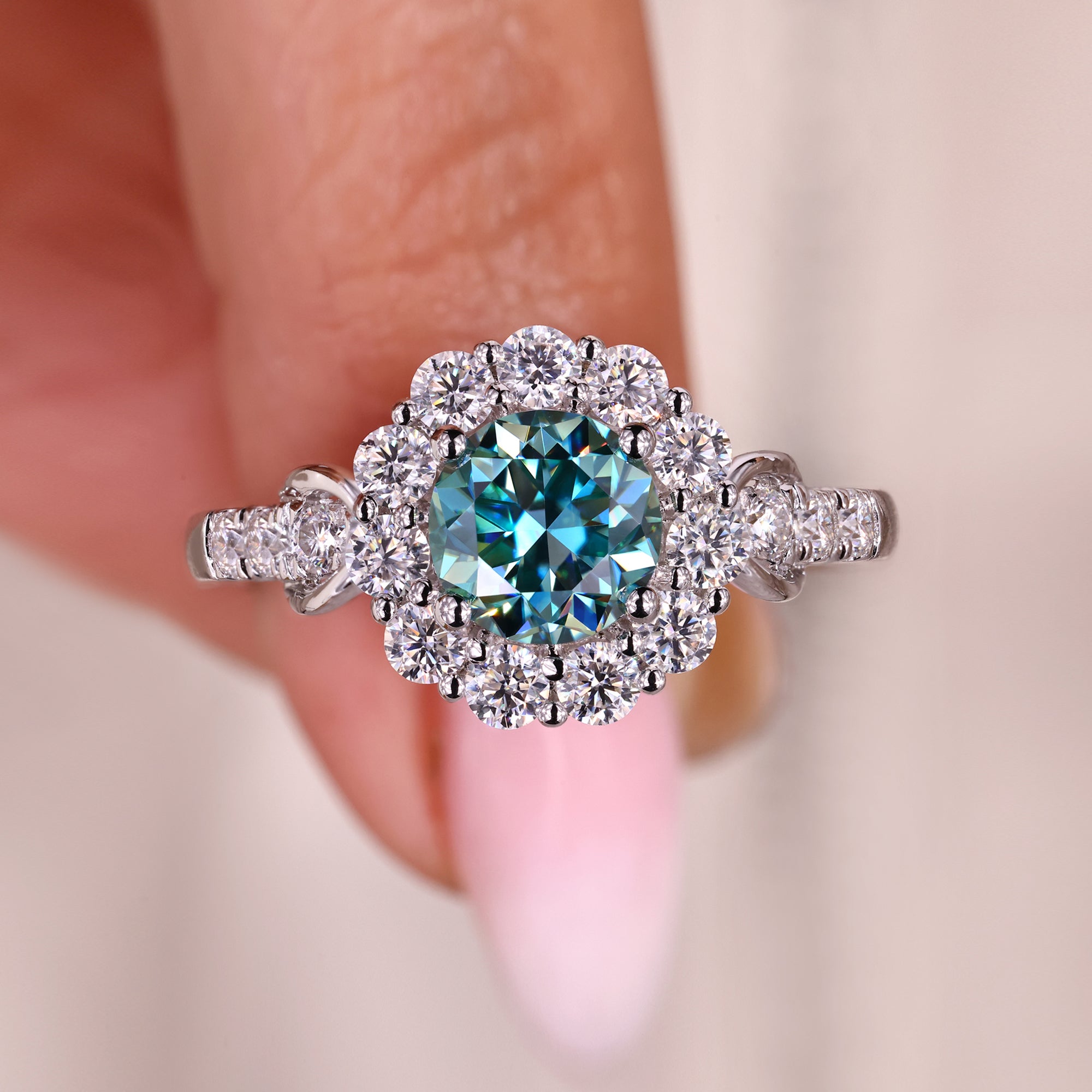 Cyan blue moissanite ring with a vibrant glow.