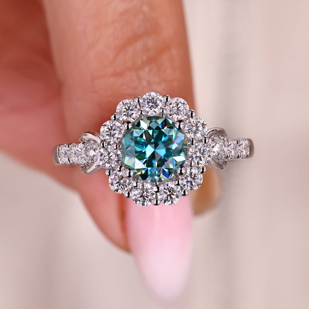 Cyan blue moissanite ring with a vibrant glow.