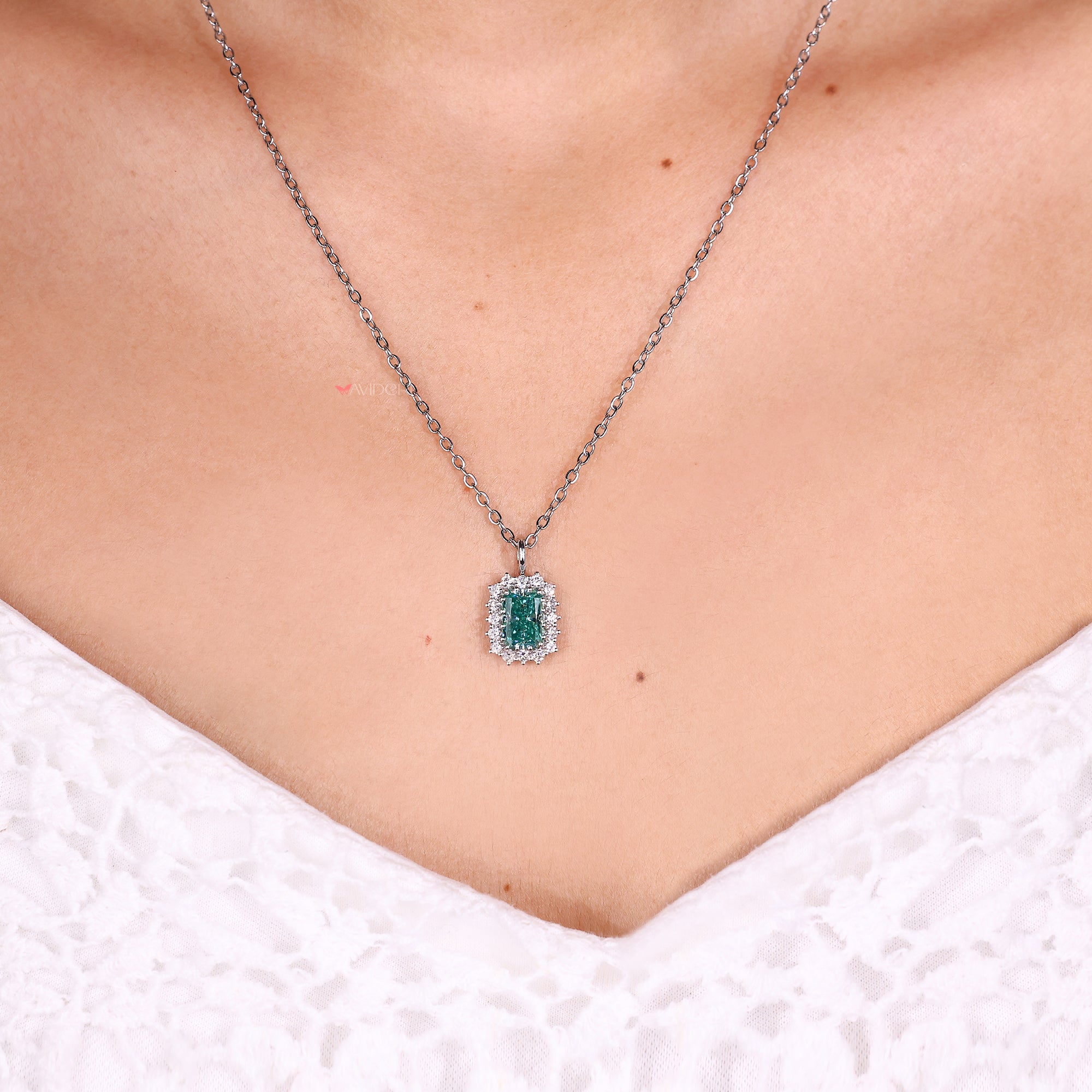 Handmade radiant cut cyan blue moissanite pendant.
