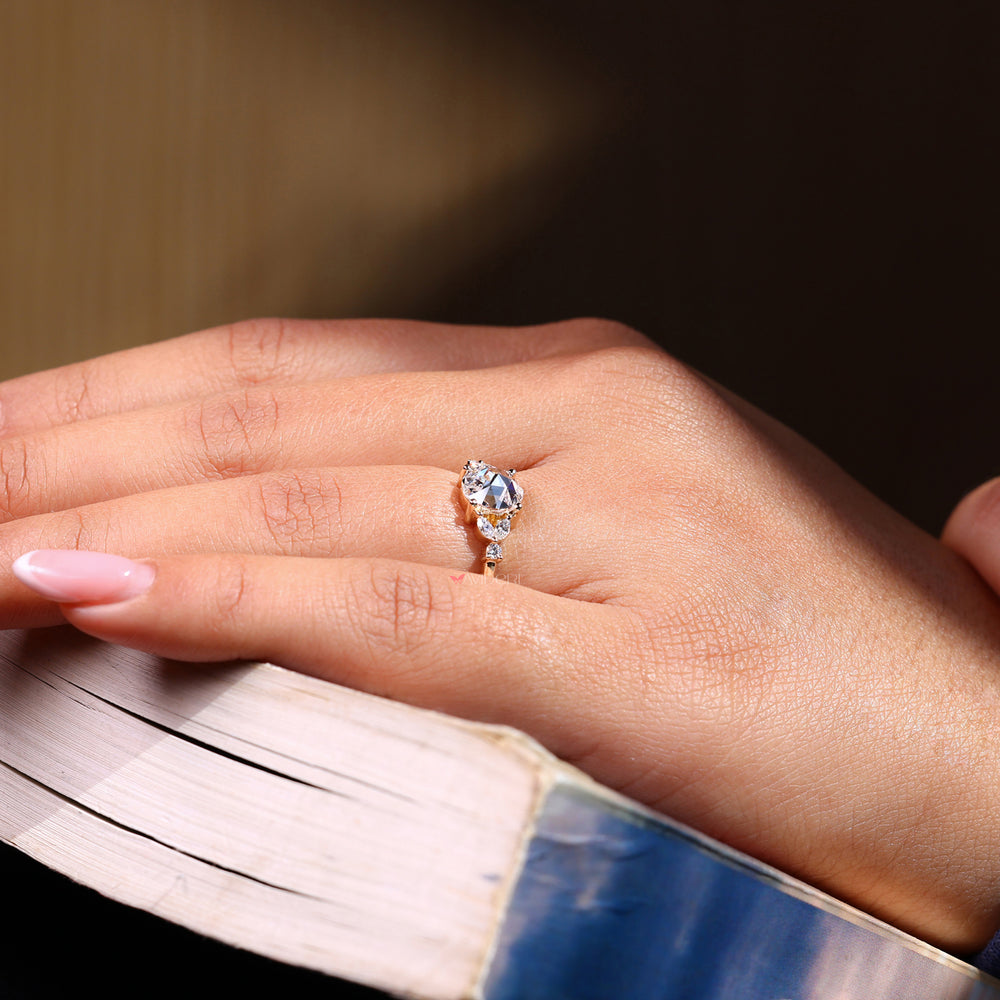 Marquise cut diamond ring featuring a delicate rose cut diamond.
