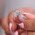 Halo engagement ring in split shank diamond ring.