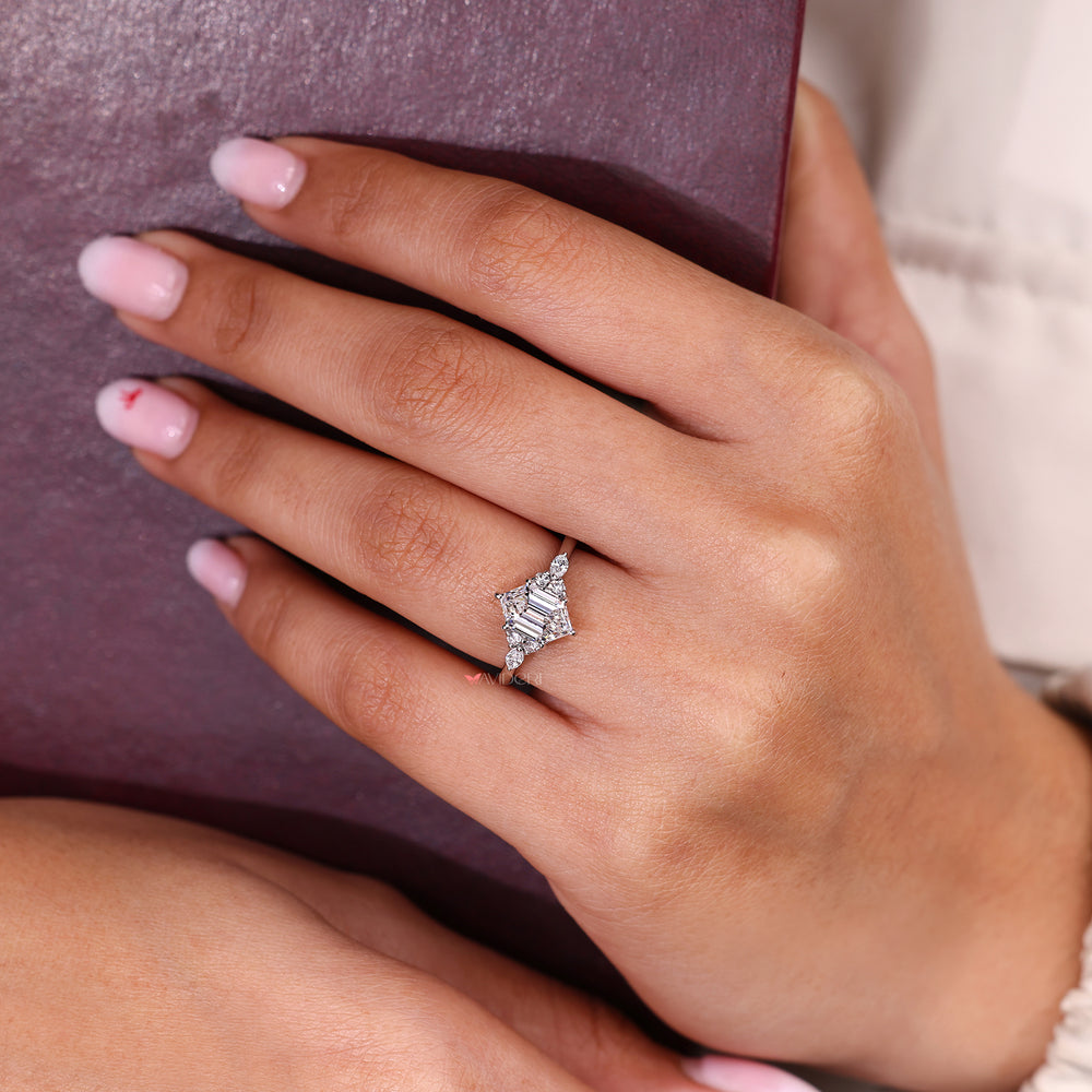 Hexagon step cut diamond seven stone ring with side accents.