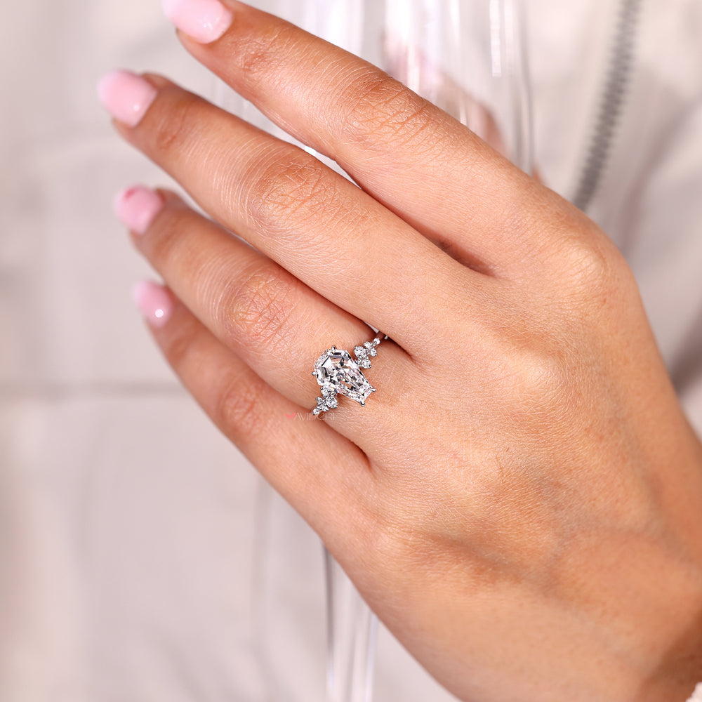 Coffin cut engagement ring with hidden round stones.