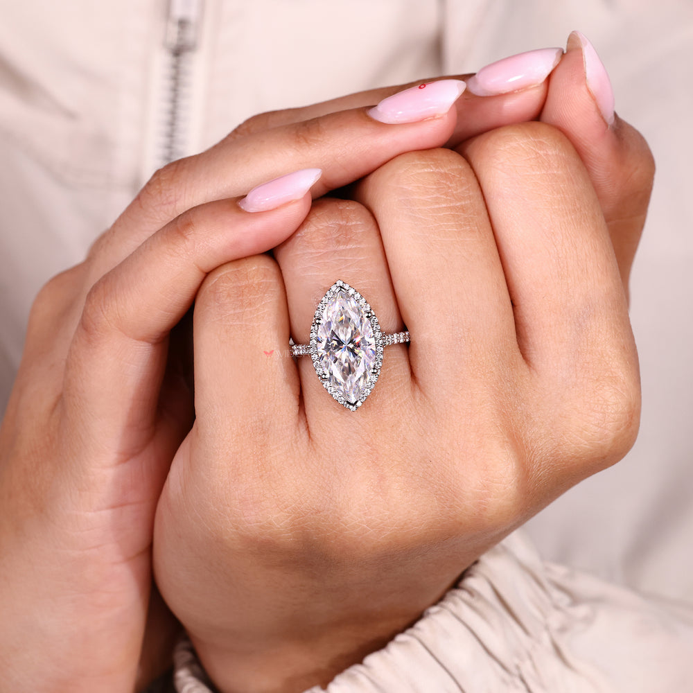 Marquise engagement ring with pave band and v prongs.