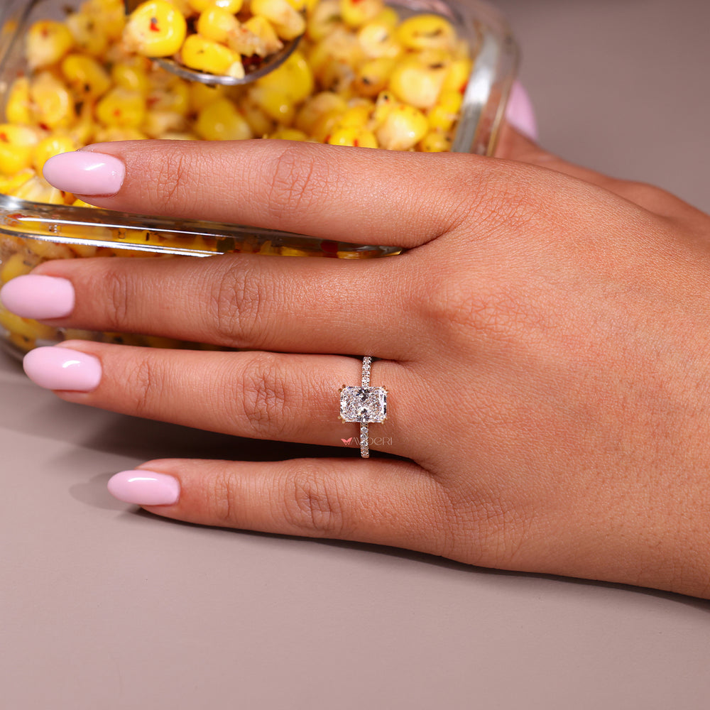 Double claw prong engagement ring with handmade jewelry elegance.
