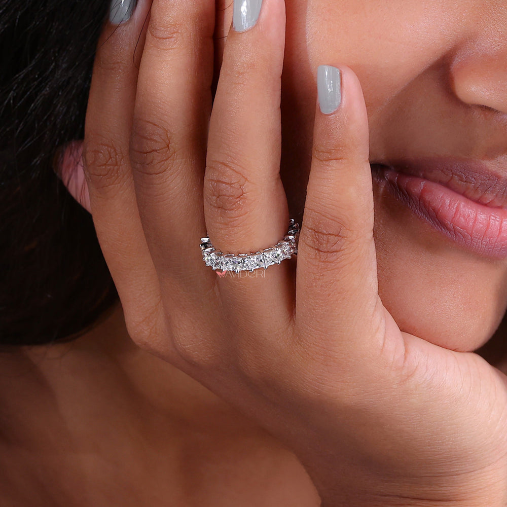 Full eternity band with continuous diamonds around the ring.
