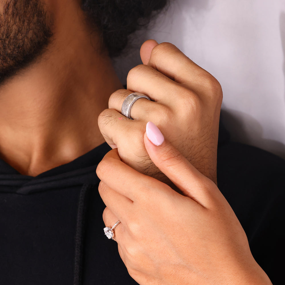 Round cut diamond men’s wedding ring.