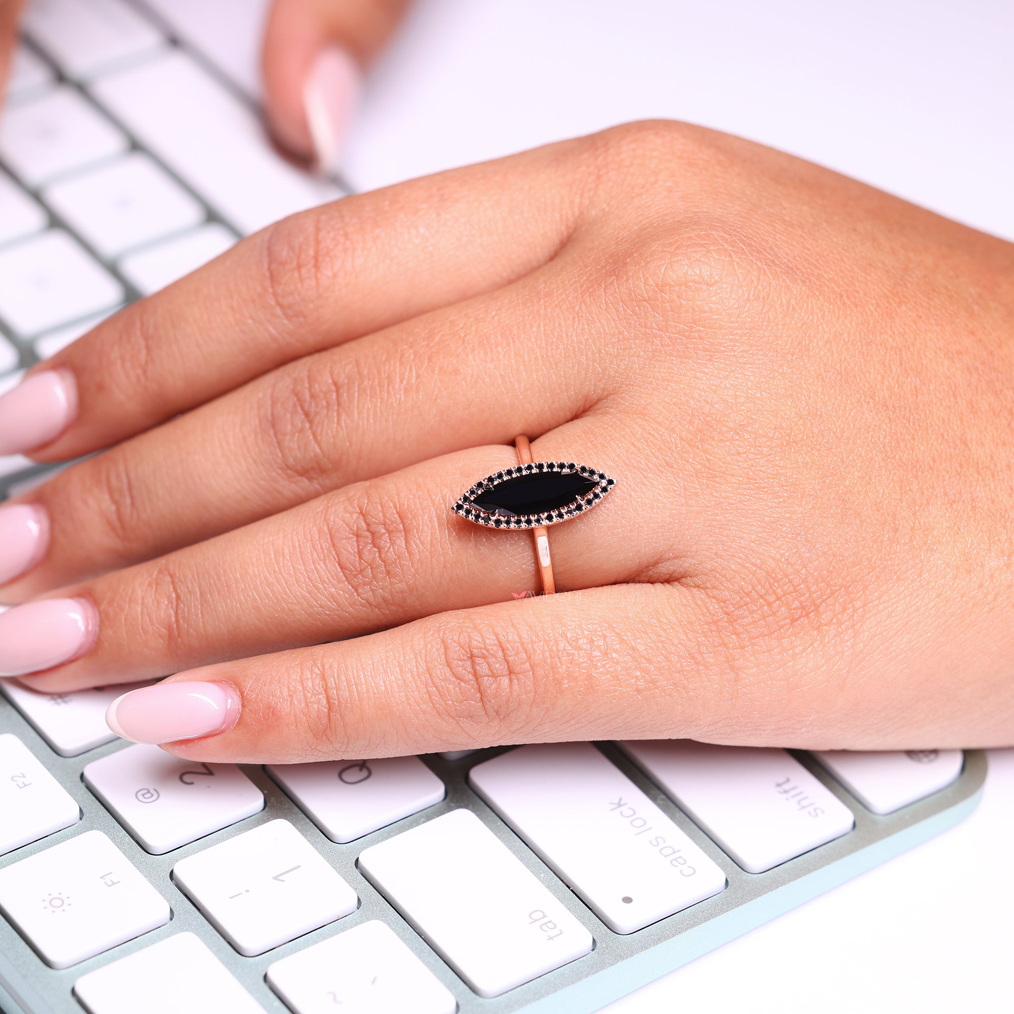 Black moissanite ring with a bold sparkle.
