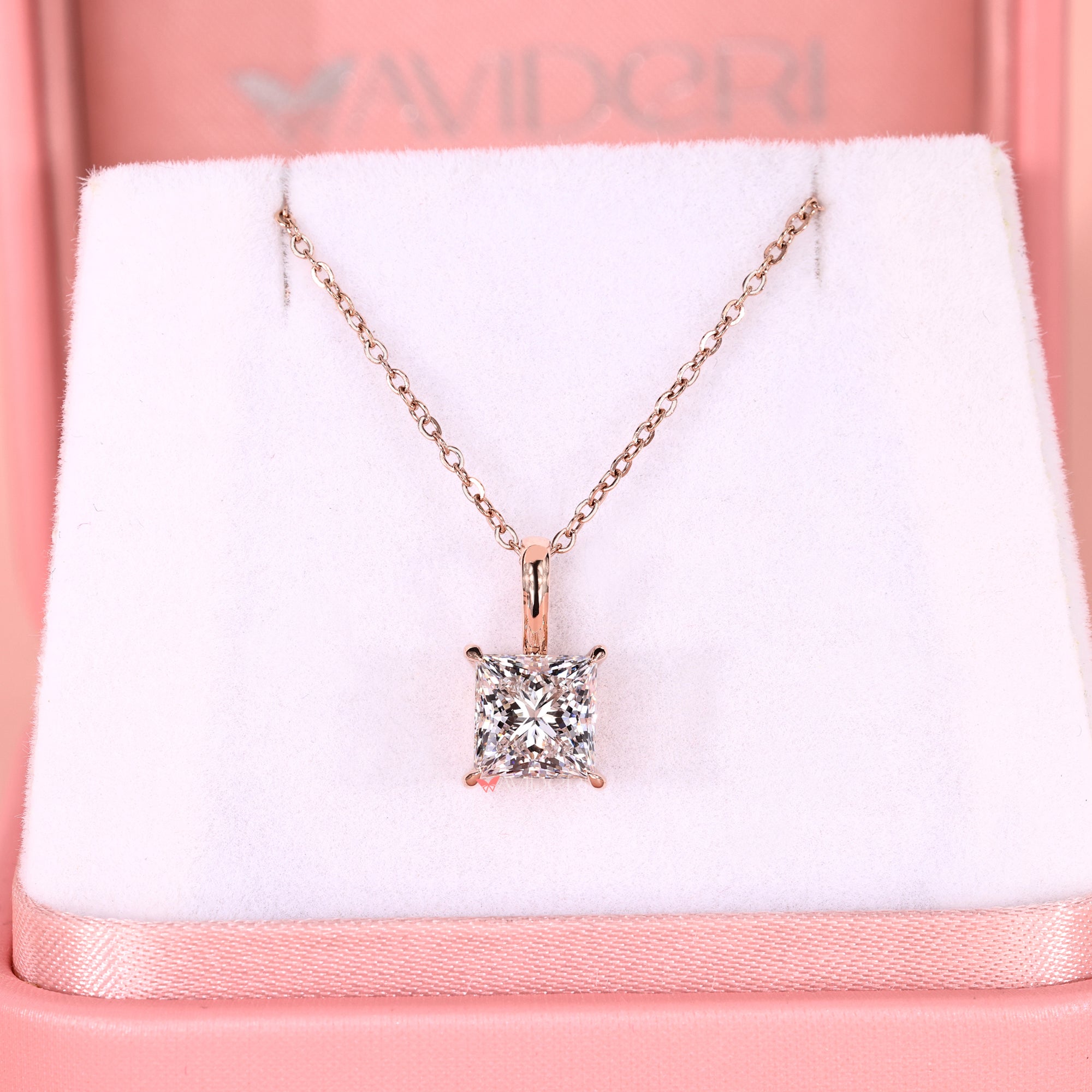 Princess solitaire pendant with diamond pendant.