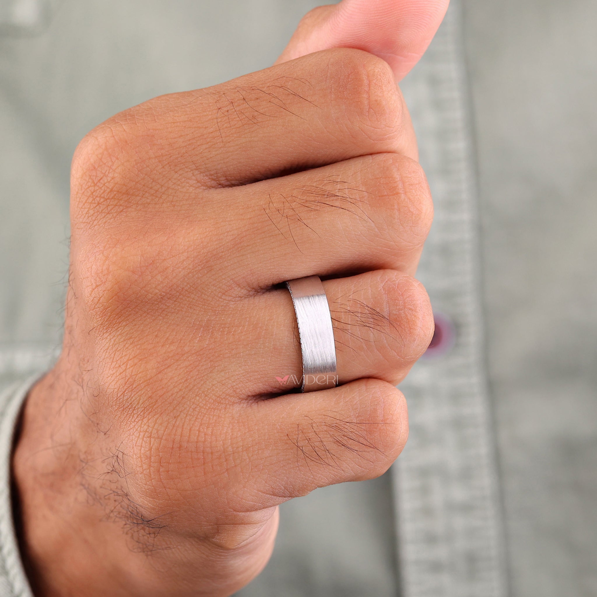 Matte finish band featuring a round diamond wedding band for modern appeal.
